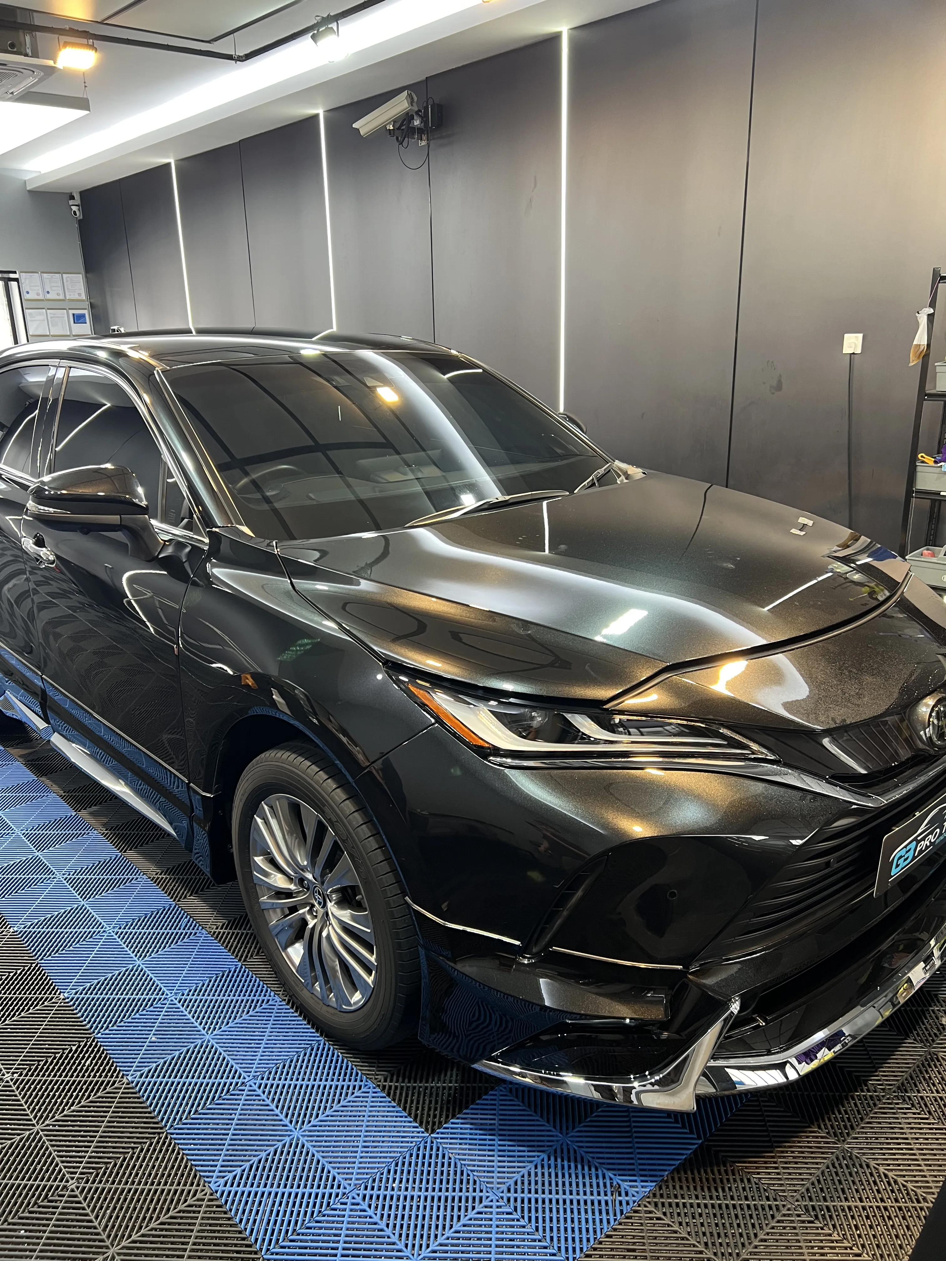G3 showroom photo of a dark grey SUV showing its windscreen and side windows